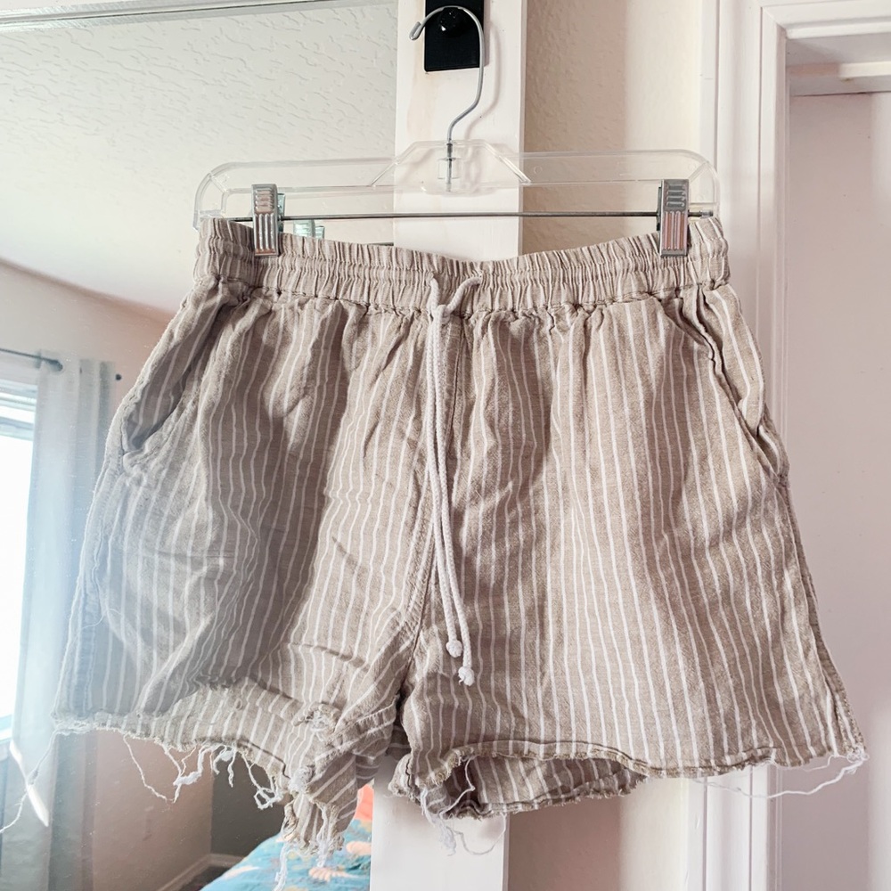 Frayed-edge, high waisted linen shorts